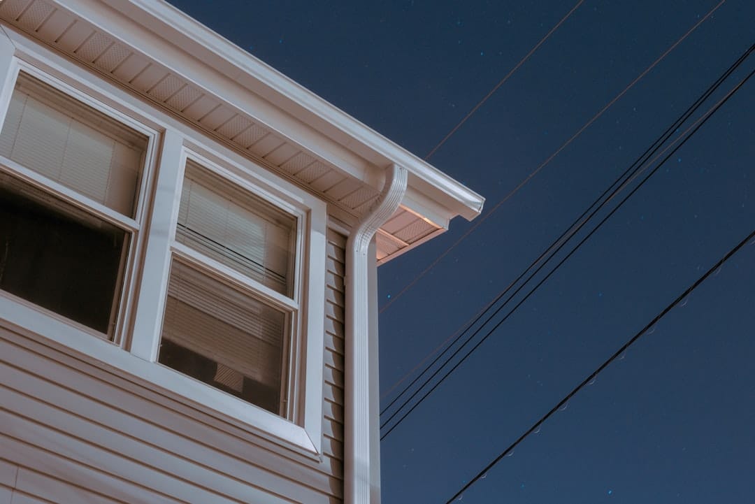 An aerial view of a row of identical suburban houses, symbolizing the 'sea of sameness' problem caused by non-standardized real estate data feeds.