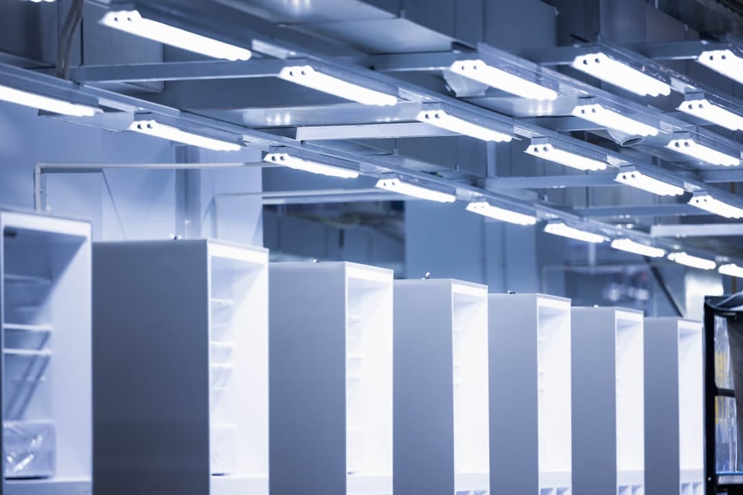 A clean, modern data center with rows of server racks illuminated by glowing blue lights, representing structured, machine-readable data.