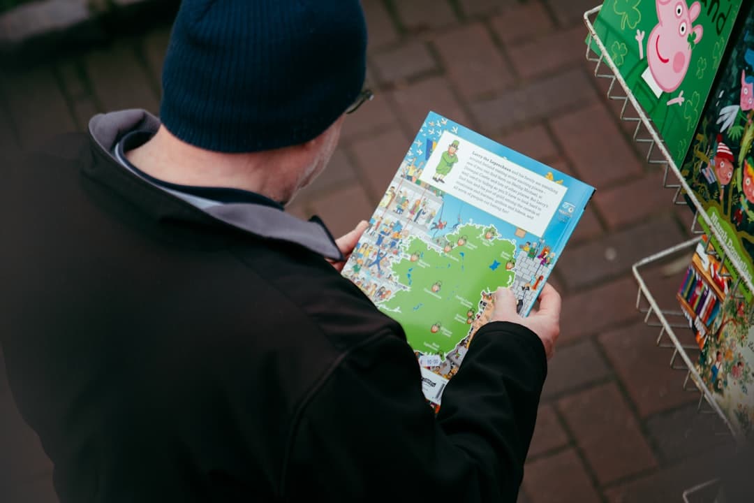 A close-up of a person's hands holding a digital tablet displaying a map with multiple location pins, representing hyper-local service areas.
