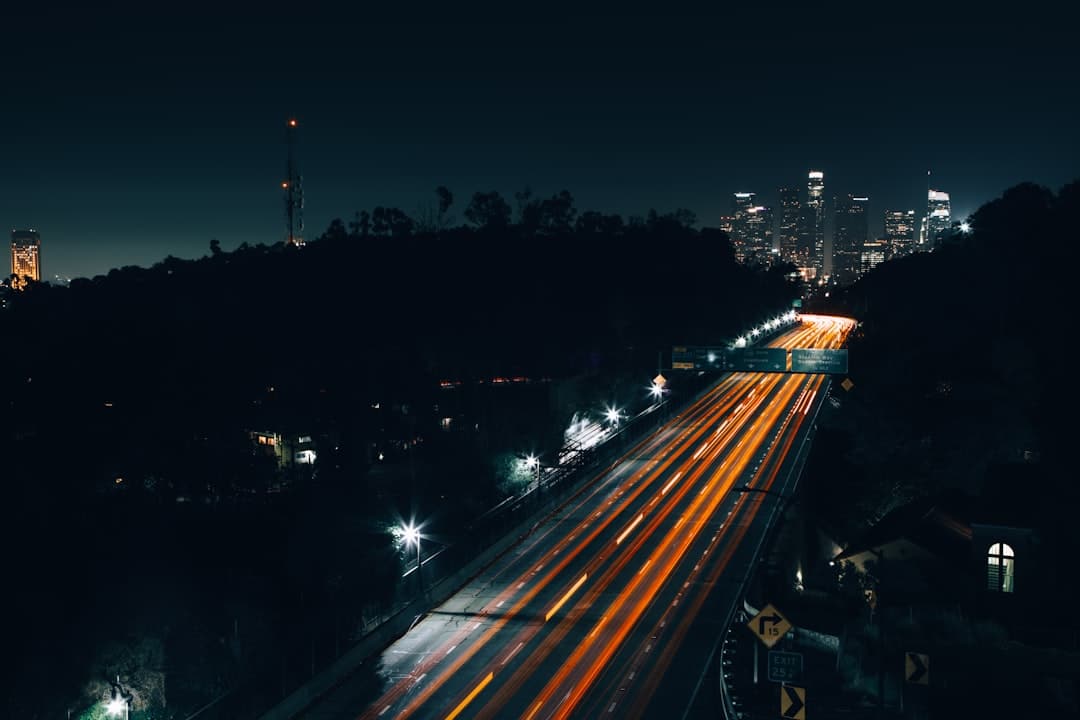 A dynamic, professional photograph of a modern city at dusk, with bright trails of light connecting various buildings, illustrating a powerful multi-location digital network.