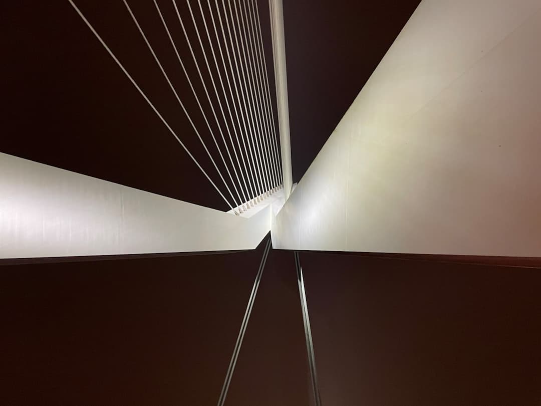 Sleek, modern bridge gracefully connecting two separate landmasses, symbolizing the connection between complex SEO activit...
