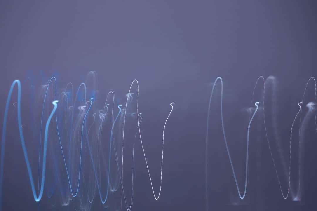 An abstract visualization of glowing blue nodes and interconnected lines on a dark background, representing a complex knowledge graph and structured data for AI.