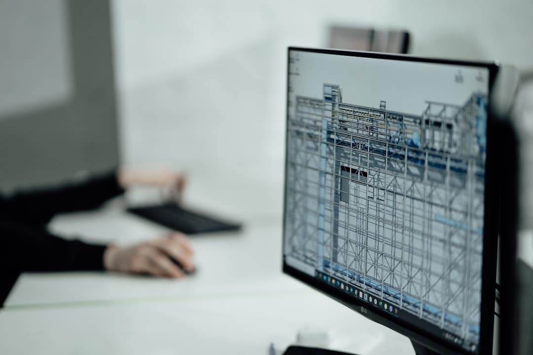 Detailed architectural blueprint spread across a clean, modern desk, symbolizing a strategic plan for building a digital k...