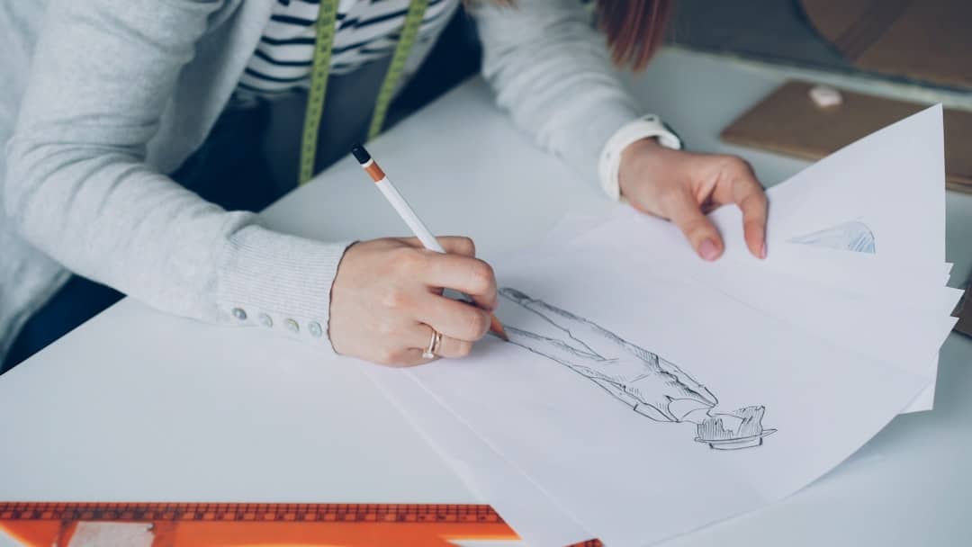 Architect's hands carefully drawing a precise blueprint on a clean, bright desk, symbolizing the strategic planning of a s...