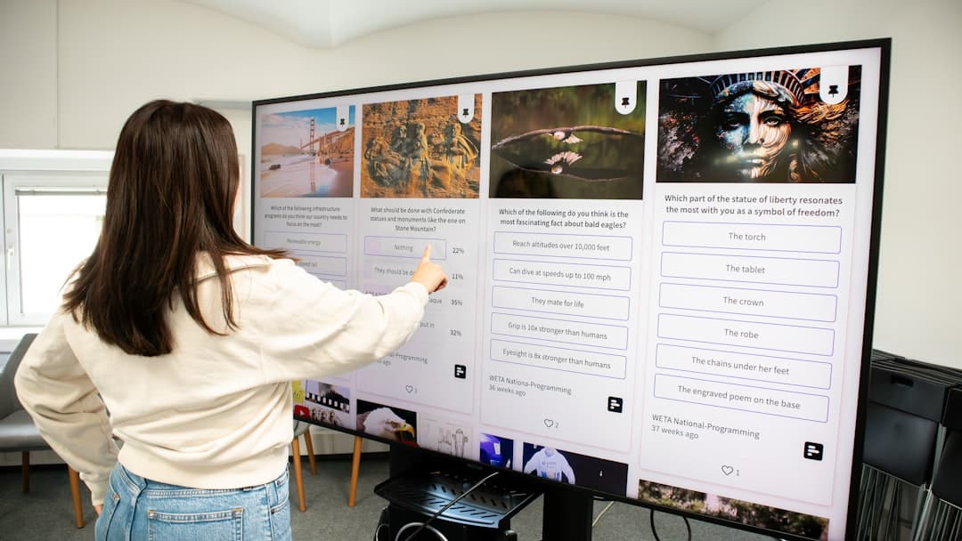 A person interacting with a futuristic, transparent screen displaying clean data visualizations, illustrating the integration of technical data into business systems.