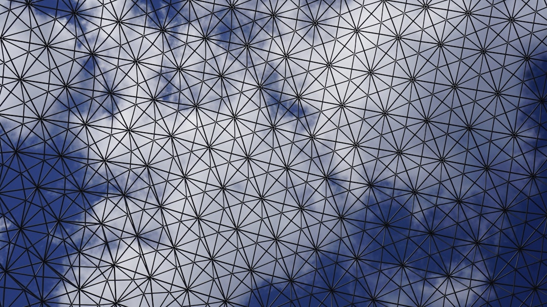 An abstract technological background with glowing blue lines connecting nodes, symbolizing a complex data network like the RESO Web API.