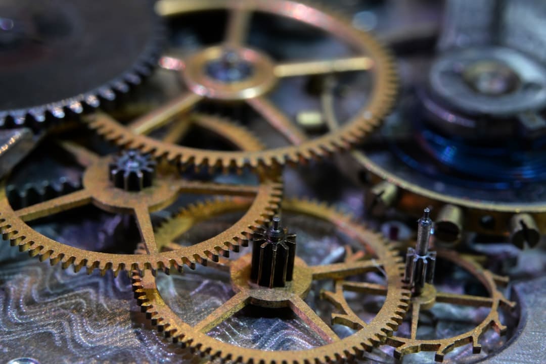 Close-up of clean, intricate modern gears interlocking, representing a complex and efficient system in a brightly lit, pro...