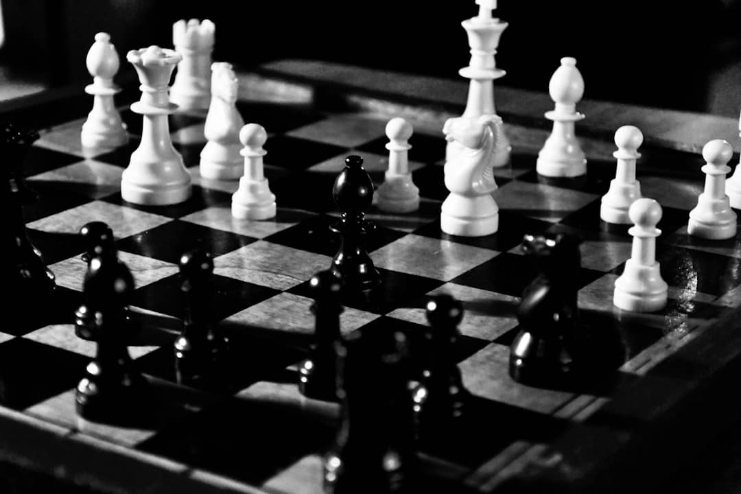 Close-up of a modern chess set with one piece making a strategic, game-winning move, representing a competitive business a...