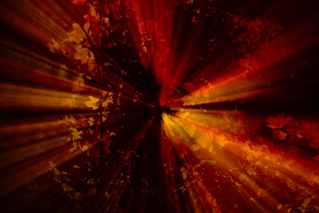 A modern, abstract image of multiple bright light streams converging on a single central point, representing the unification of data into a canonical hub.
