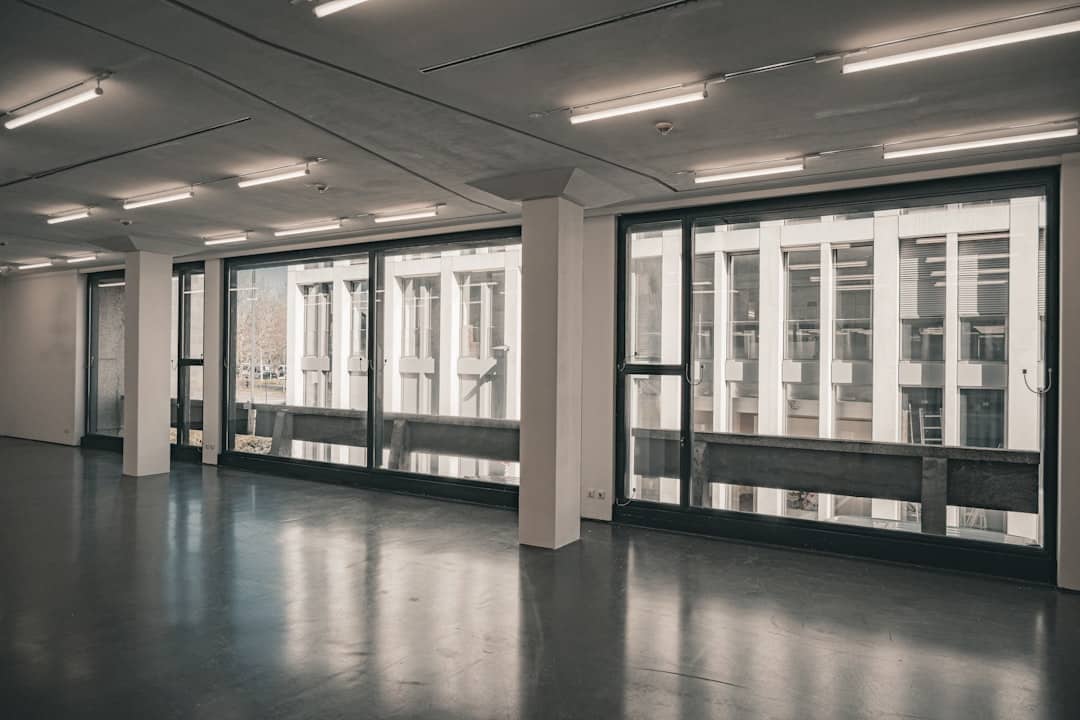 Brightly lit, modern data center with rows of server racks, representing structured MLS data infrastructure for brokerages.