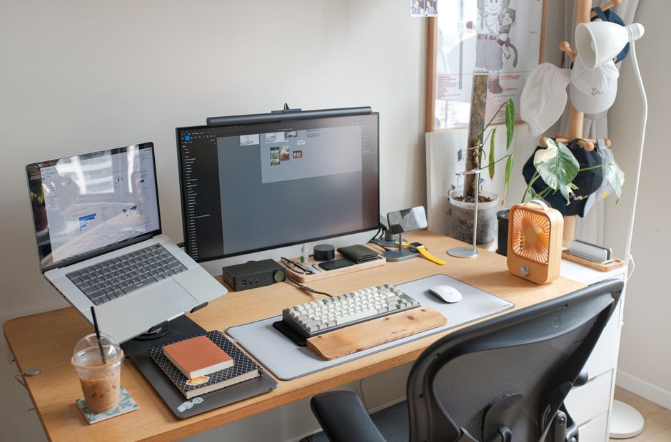 A clean, minimalist desk setup with a modern laptop and notebook, symbolizing a clear and organized approach to a monthly SEO package.