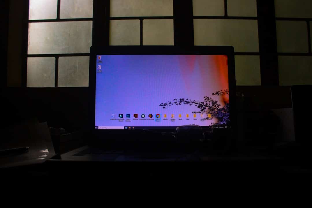 Close-up of a modern computer screen displaying a colorful digital audio sound wave, representing the analysis of customer...