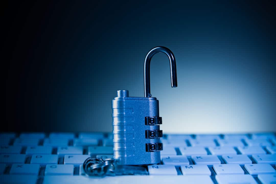 A modern, glowing digital padlock superimposed over a network of data connections, symbolizing the verification and security pillar of the Brand Immunity Framework.