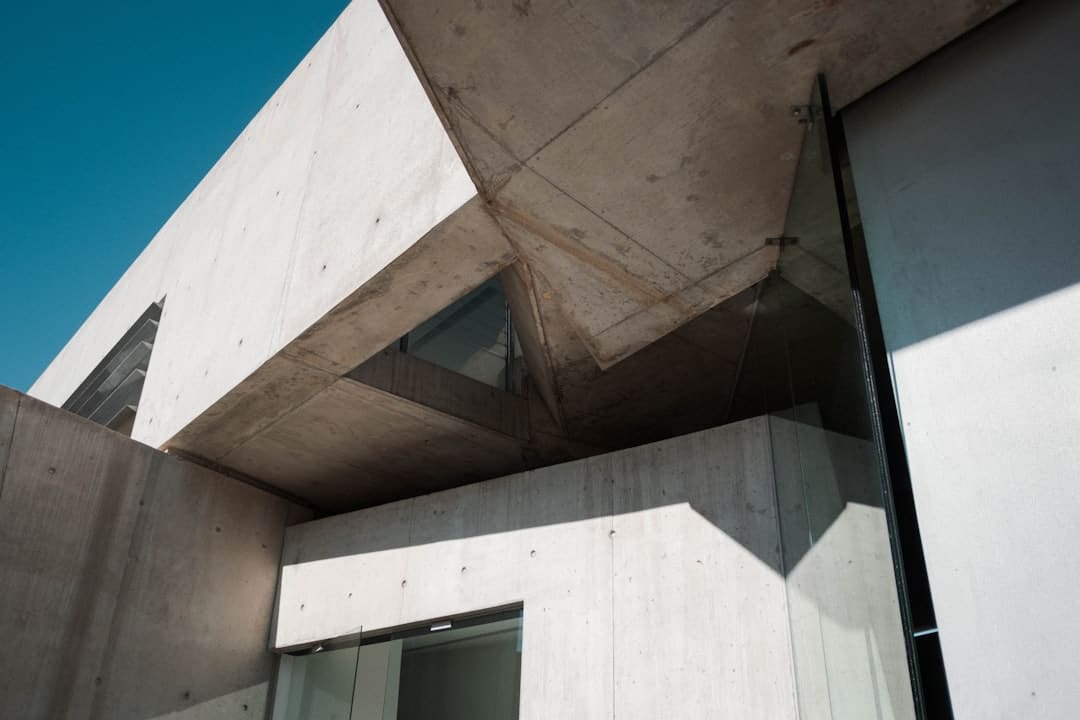The strong, clean lines of a modern building's foundation, illustrating a well-maintained and preserved SEO asset built on solid data.