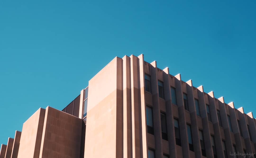 The clean, repeating lines of a modern building's facade, illustrating the principles of structure, order, and data standardization found in an MLS.