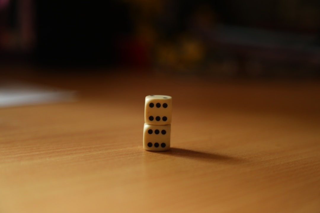 A single domino tipping over to start a chain reaction with a long line of other dominoes, illustrating how one business event can trigger a significant SEO impact.