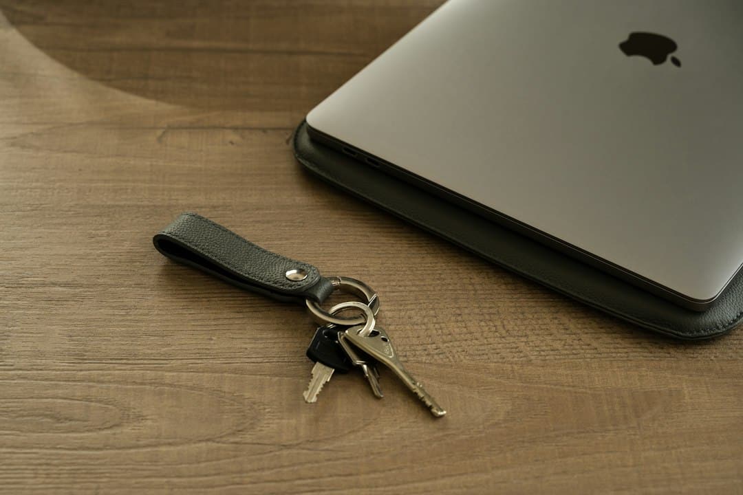 An ornate vintage brass key rests on the keyboard of a sleek, modern laptop, illustrating the concept of unlocking digital ownership and securing brand data in the new frontier of AI.