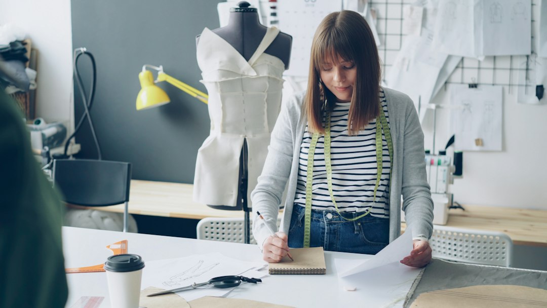 A professional architect meticulously working on a complex blueprint in a modern office, representing strategic planning for a technical SEO merger.